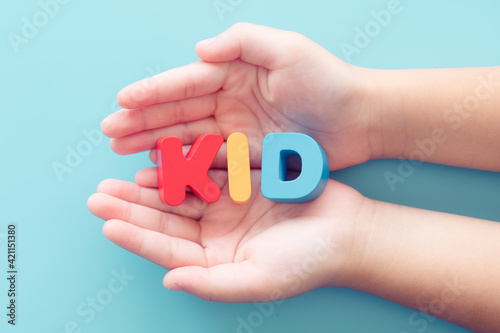 Kid word on woman hands.Family adoption.Safe and protect child kids.bully in school.Pediatric healthcare medical.Kid Vaccine.Online education learning at home.New normal boy and girl.People children.