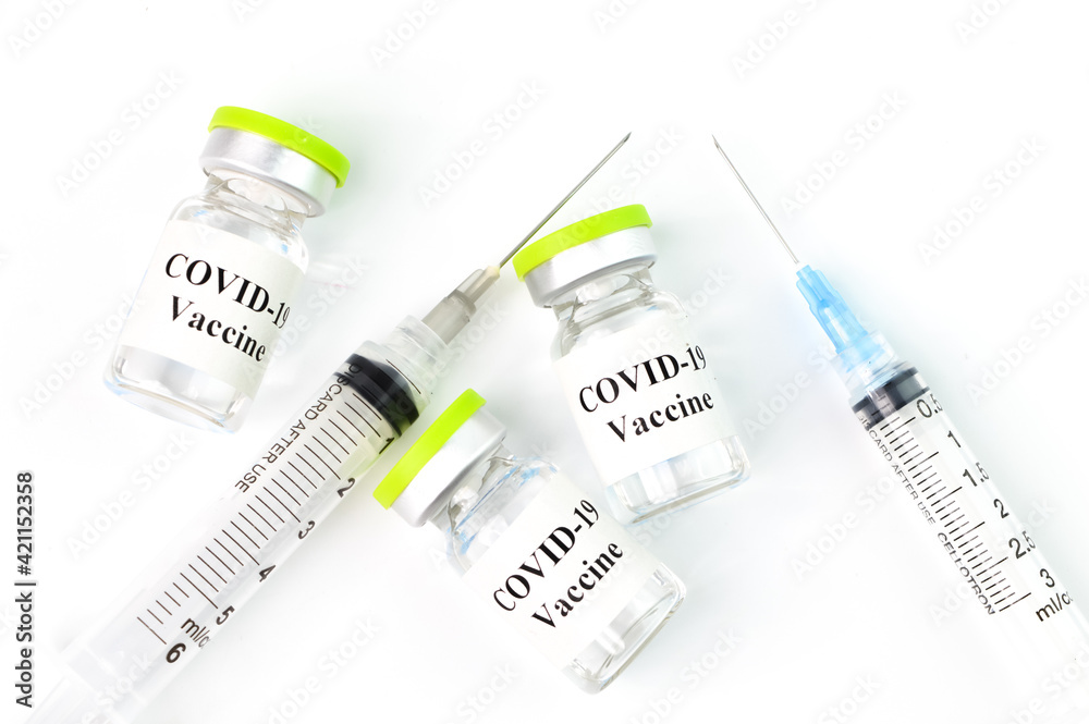 yringe and Covid-19 bottle vaccination over white background. yringe and Covid-19 bottle vaccination over white background.