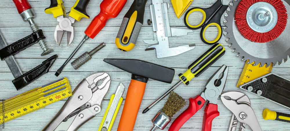 set of different hand tools on grey background top view set of different hand tools on grey background top view