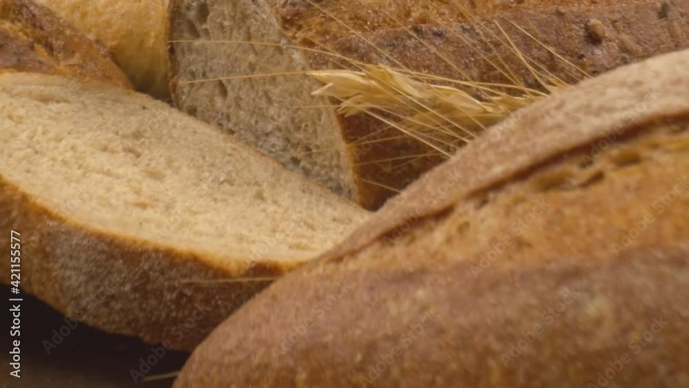 Close-up of fresh baked whole grain bread move in slow motion.