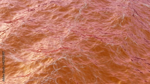 Red orange water in ocean or sea at a beautiful sunset