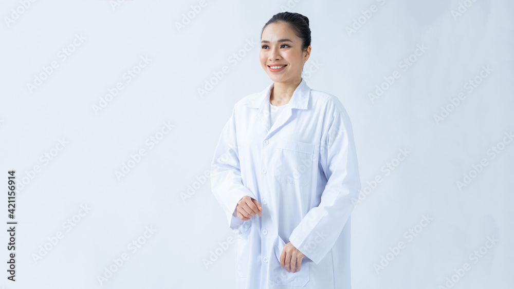 Portrait of smiling young asian female doctor in a background for your text. Portrait of smiling young asian female doctor in a background for your text.