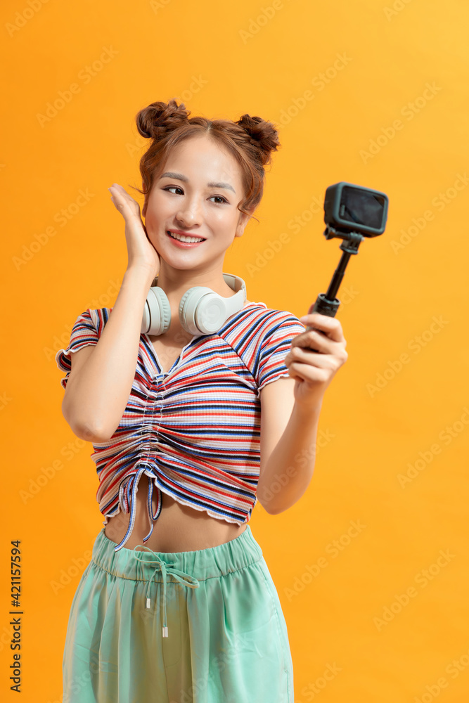Pretty thai woman taking selfie with action camera Pretty thai woman taking selfie with action camera