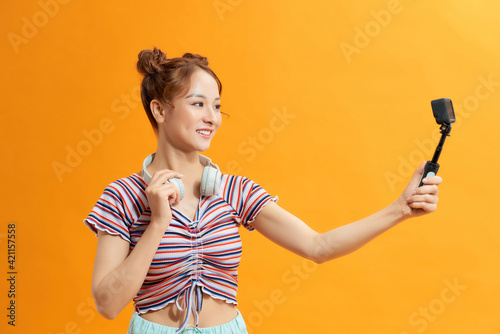 Asian girl tourists enjoy the GoPro camera