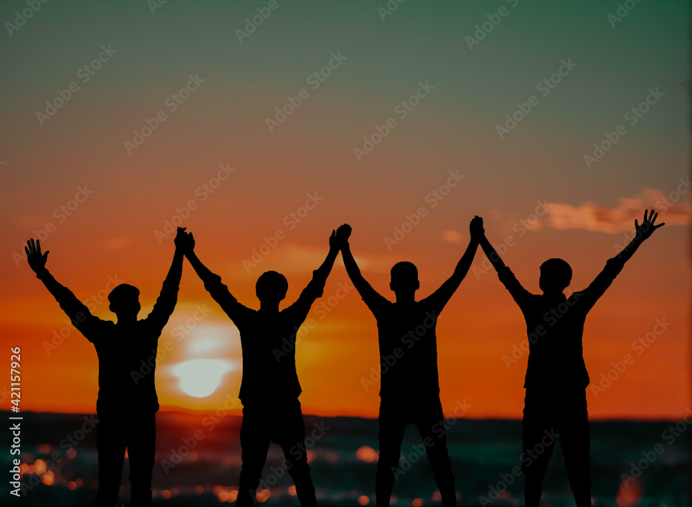 Fototapeta premium group of people at sunset