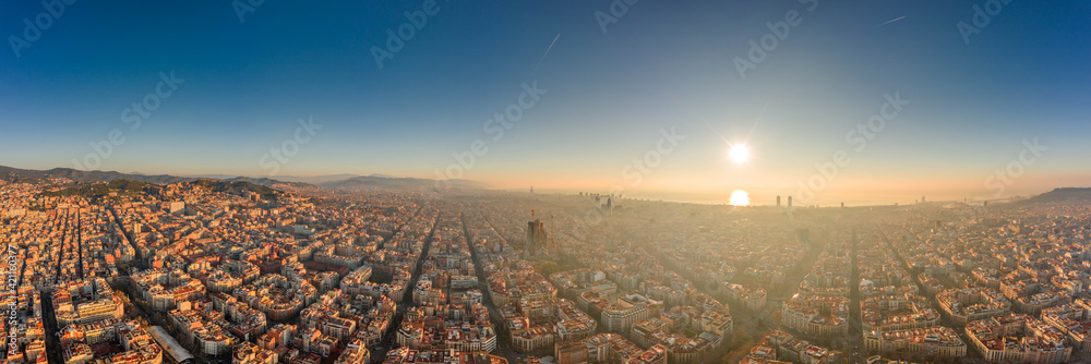 360 aerial panorama drone shot of skyline in Barcelona city center in foggy sunrise golden hour in Spain winter - obrazy, fototapety, plakaty 