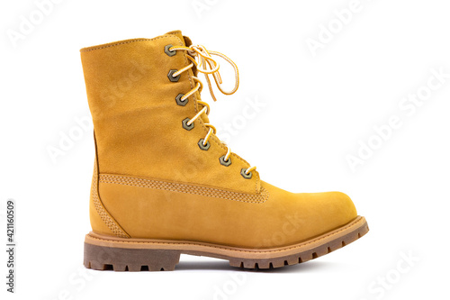 Single short yellow suede boot isolated on white background. Fashion and shopping concept