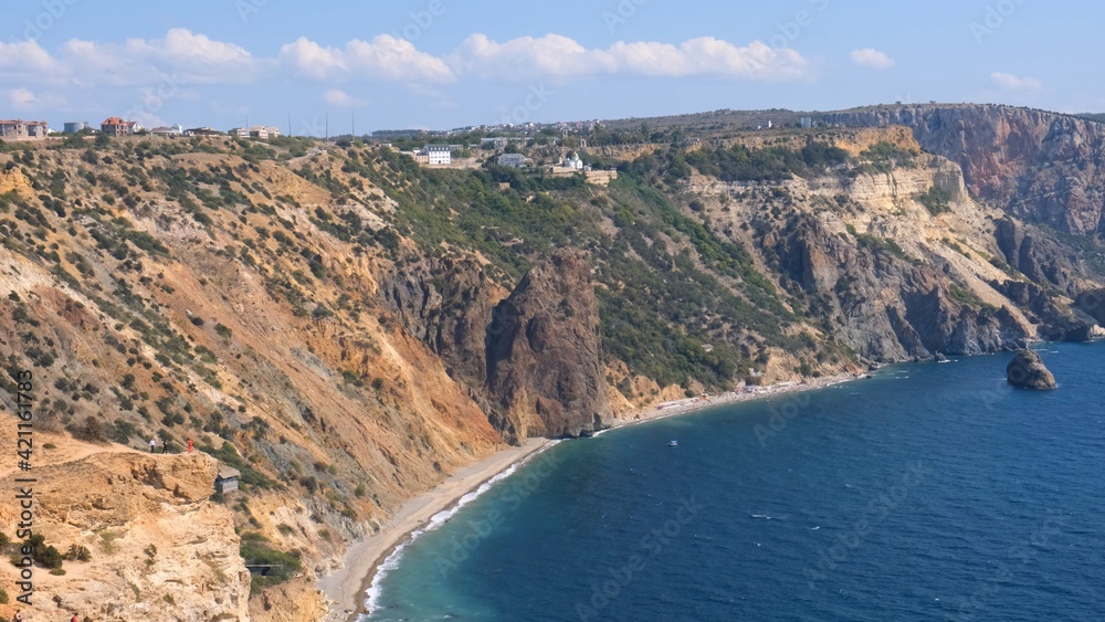 Beautiful view of the coast of the turquoise sea and mountains at Cape Fiolent, Crimea. The concept of tranquility, silence and unity with nature.