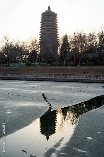 Winter ice surface of Cishou Temple Pagoda photo