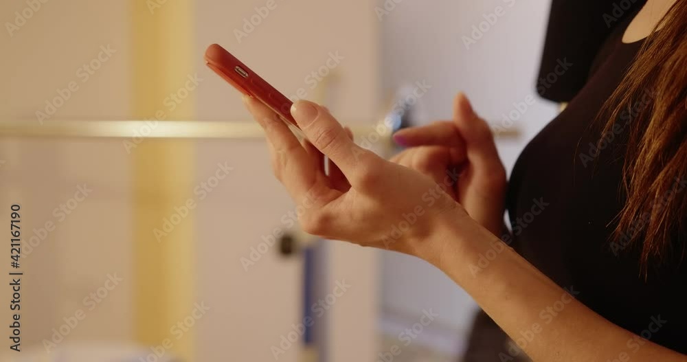 Side view of female hands swiping and tapping smartphone screen. Unrecognizable young Caucasian millennial messaging online using social media on phone. Lifestyle concept. Cinema 4k ProRes HQ.