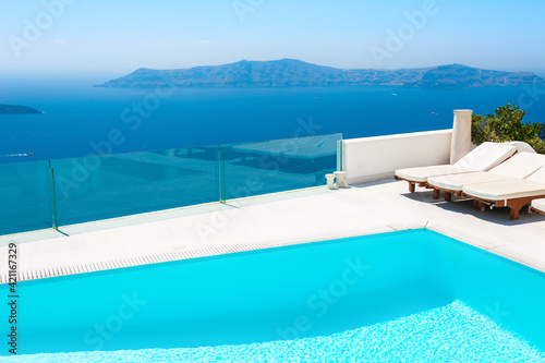 Santorini island  Greece. Luxury swimming pool with sea view. Famous travel destination