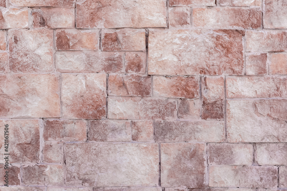Fototapeta premium Exterior of a residential building. Decorative masonry is applied to the wall.