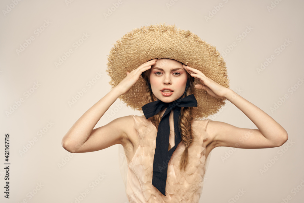 Cheerful woman in straw hat elegant style cosmetics close-up Cheerful woman in straw hat elegant style cosmetics close-up