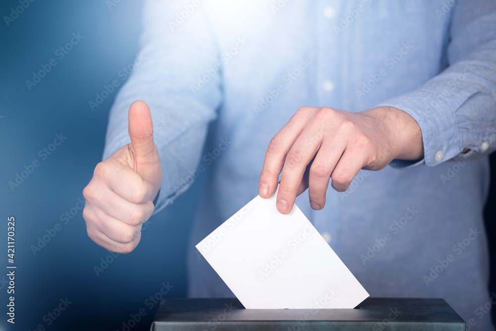 Voter Putting Ballot Into Voting box. Voter Putting Ballot Into Voting box.