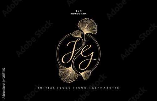 JG initial letter script and graphic name with ginkgo leaf, JG or GJ Monogram, for Wedding couple logo monogram, logo company and icon business, with golden colors designs isolated black backgrounds