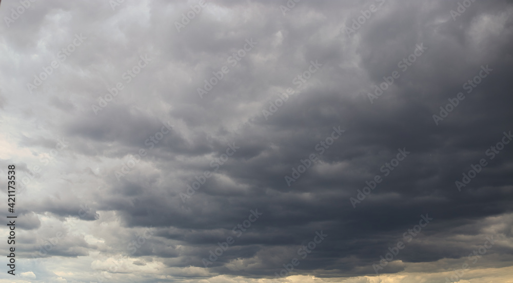 Dramatic cumulonimbus stormy clouds over city of