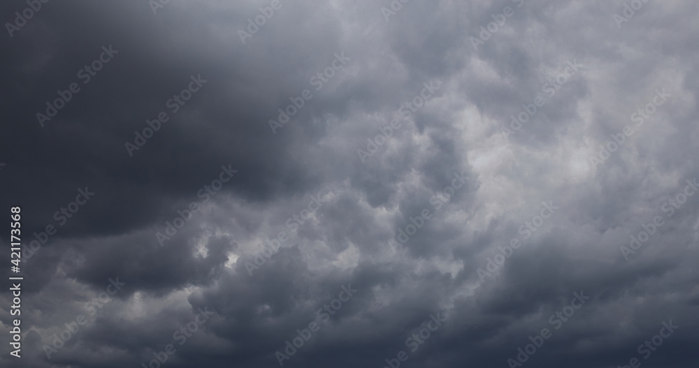 Dramatic cumulonimbus stormy clouds over city of