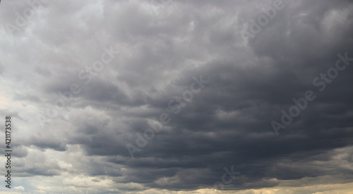 Dramatic cumulonimbus stormy clouds over city of