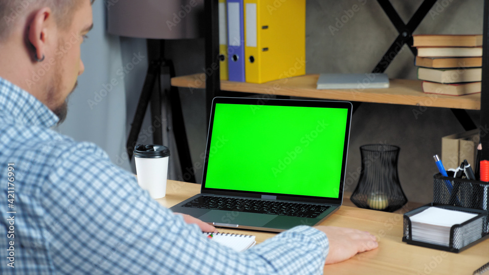 Green screen mock up chroma key display monitor laptop computer concept: Businessman at home office listen company top manager employee online remote conference webcam video call business meeting chat Green screen mock up chroma key display monitor laptop computer concept: Businessman at home office listen company top manager employee online remote conference webcam video call business meeting chat