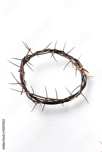 Crown of thorns isolated on white background. Top view. Copy space. Christian Easter concept. Crucifixion of Jesus Christ. He risen and alive. Jesus is the reason. Gospel  salvation