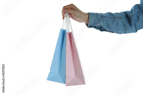 Female hand hold paper bags, isolated on white background