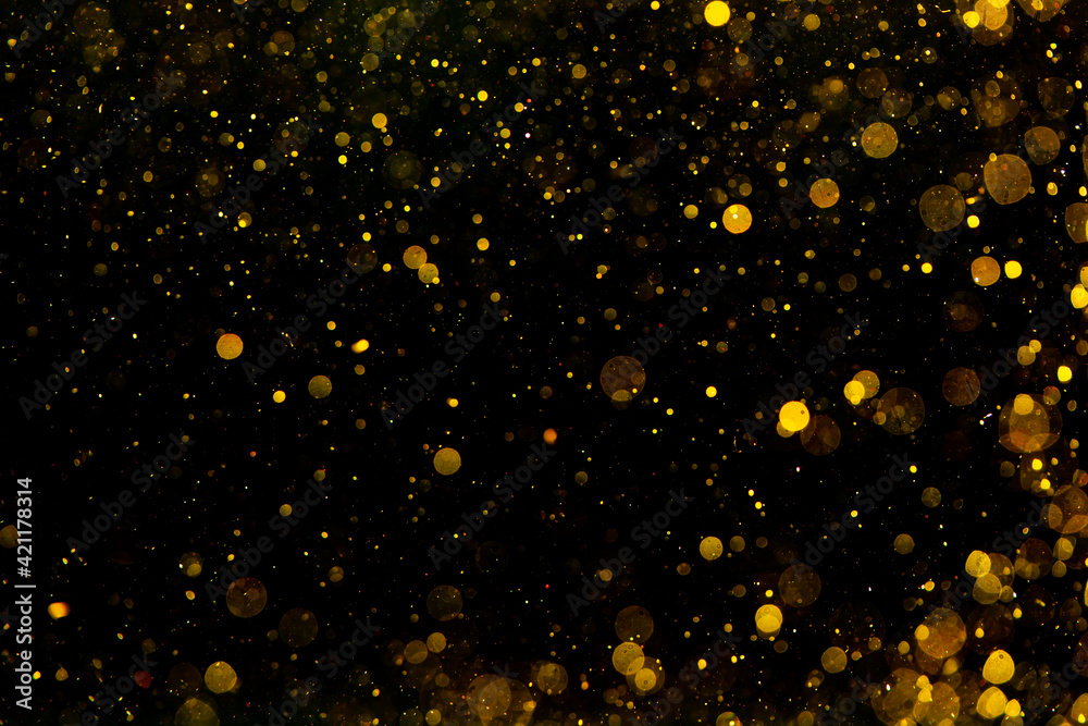 Gold and yellow bokeh of light textured glitter