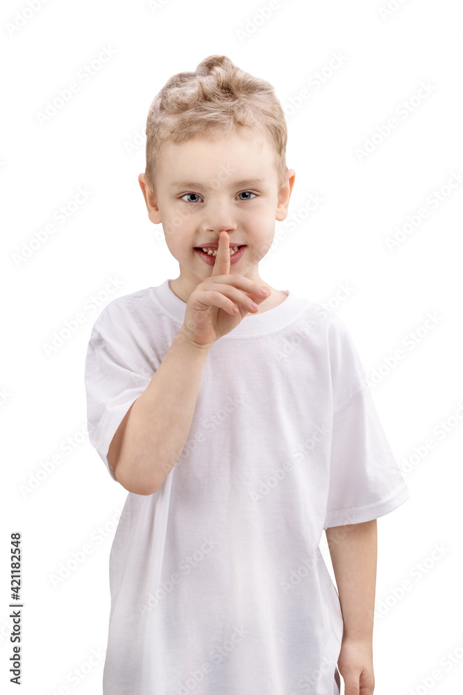 Boy with finger on lips making a silent gesture, isolated on white background Boy with finger on lips making a silent gesture, isolated on white background