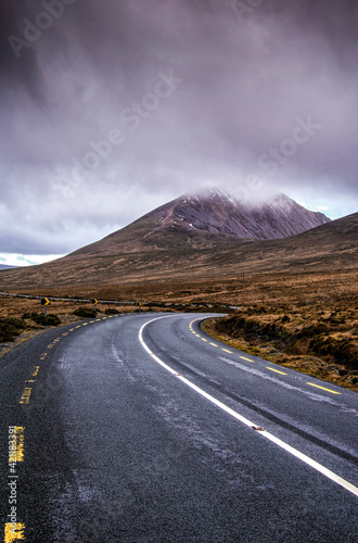 Road between the mountain and the sky