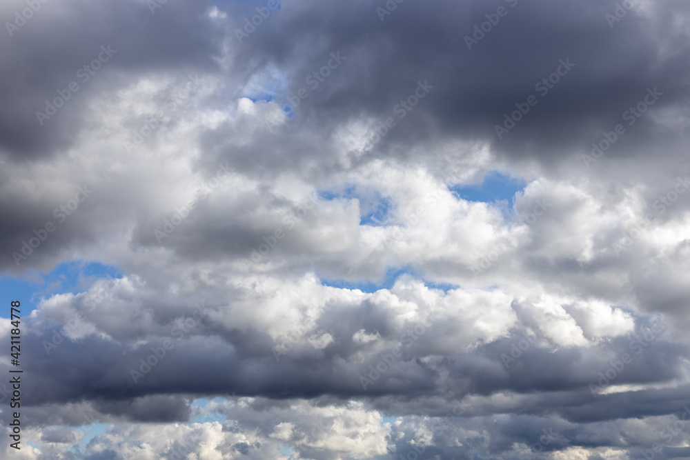Detail of a white cloud in a bright blue sky.
Dark rain clouds displace the blue sky. Storm is coming Detail of a white cloud in a bright blue sky.
Dark rain clouds displace the blue sky. Storm is coming