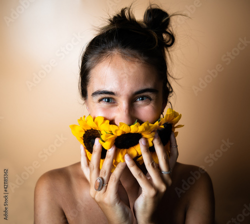 Portrait of White Woman  With Blue Eyes and Dark Hair With Sunflowers 