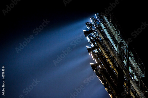 Lights at night. Spotlight illuminates the field at the sports stadium