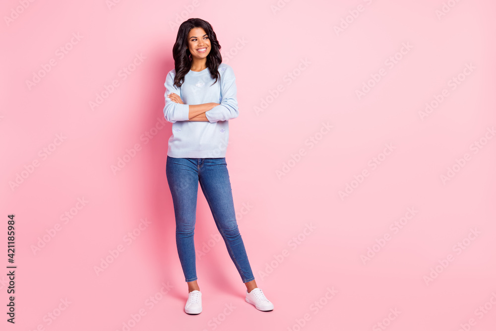 Photo of charming lady folded hands look side empty space wear blue sweater jeans shoes isolated pink background Photo of charming lady folded hands look side empty space wear blue sweater jeans shoes isolated pink background