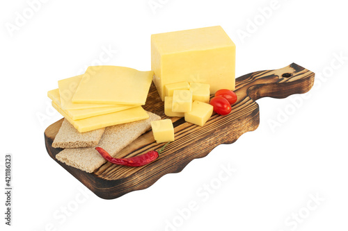 cheddar cheese with cherry tomatoes and grapes and bread on a wooden board