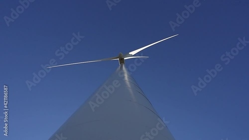 Lidkoping, Sweden Wind turbines on an open field and a blue sky.  photo