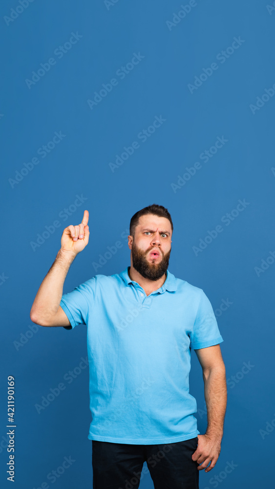 Caucasian man's portrait isolated on blue studio background with copyspace Caucasian man's portrait isolated on blue studio background with copyspace