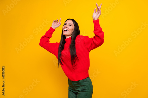 Photo of young happy positive funky woman look copyspace dancing enjoying weekend isolated on yellow color background