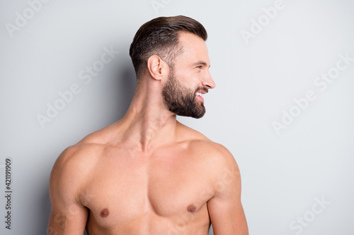 Photo of young man happy positive smile new haircut enjoy cosmetology procedure look empty space isolated over grey color background