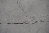 Gray concrete slab with cracks from above