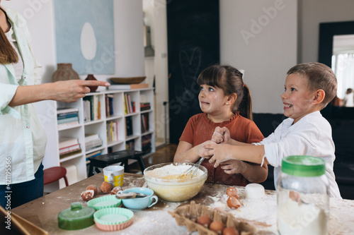 mother scold children for mess they made in kitchen