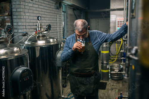 man working in mini craft brewery © cherryandbees
