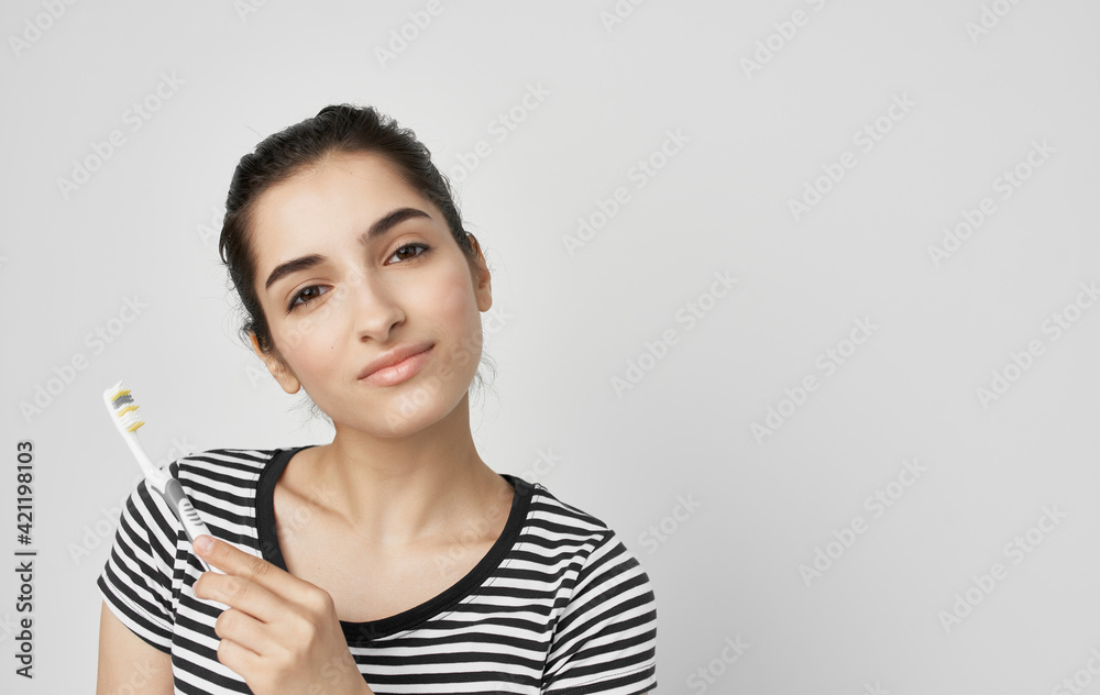 woman in striped t-shirt toothbrush dental health hygiene woman in striped t-shirt toothbrush dental health hygiene