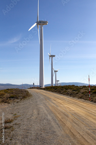 Clean electricity producing wind turbines built on a windy mountain ridge © Jesus