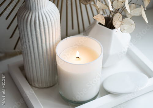 Fototapeta Luxurious white tray decoration, home interior decor with burning candle