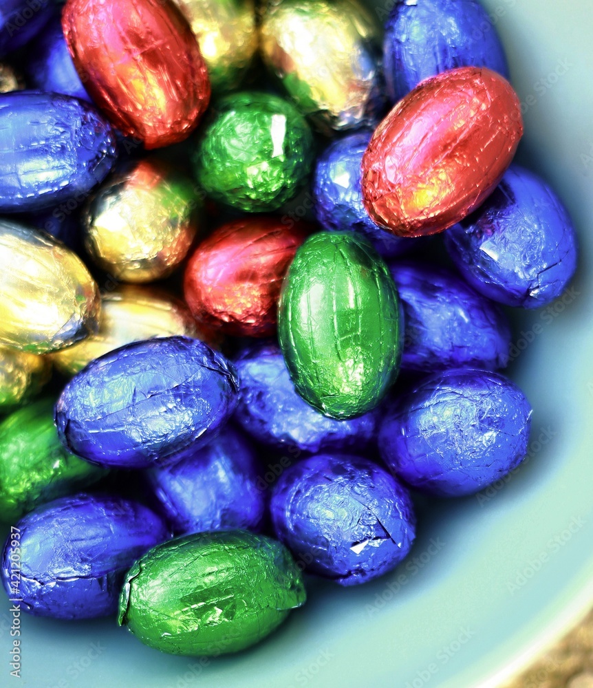 chocolate Easter eggs displayed in many colours on white background stock photo chocolate Easter eggs displayed in many colours on white background stock photo