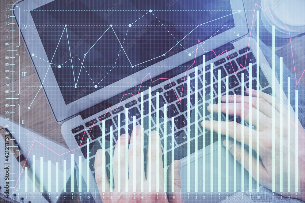 Double exposure of man's hands typing over computer keyboard and forex graph hologram drawing. Top view. Financial markets concept. Double exposure of man's hands typing over computer keyboard and forex graph hologram drawing. Top view. Financial markets concept.