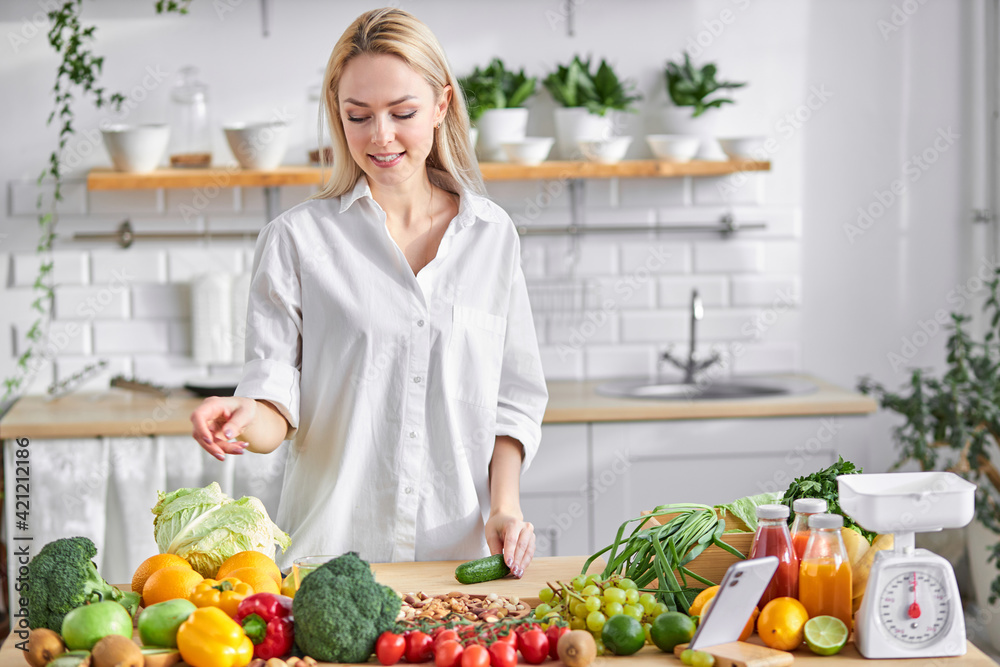 pretty female blogger vlogger and online influencer recording video content on healthy food
