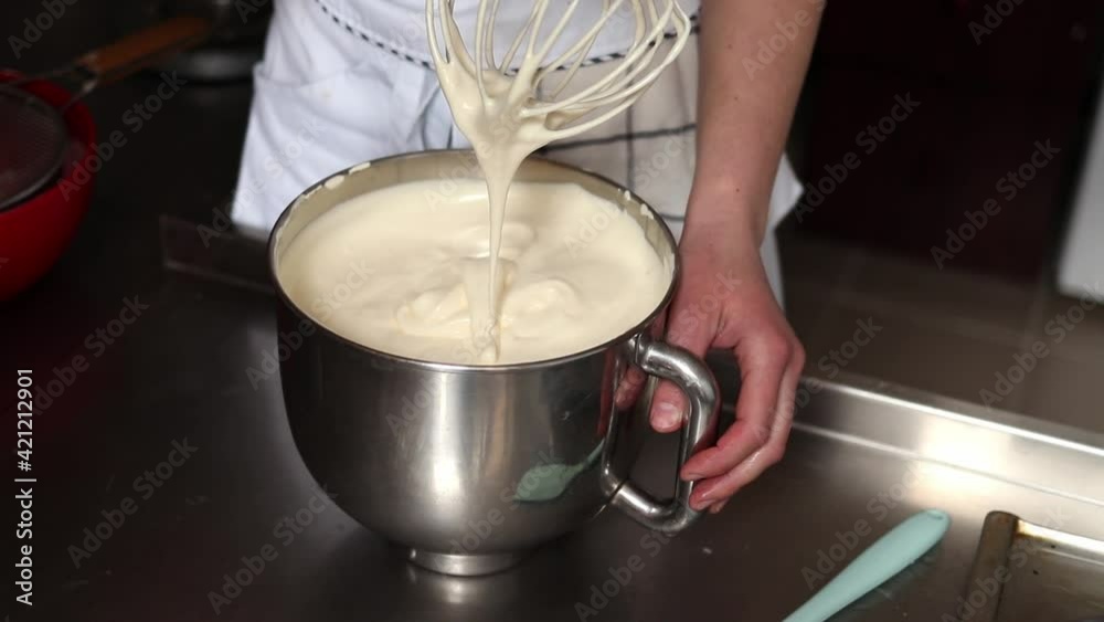 Beaten eggs, pastry chef mixes the finished dough on the cake. High quality FullHD footage Beaten eggs, pastry chef mixes the finished dough on the cake. High quality FullHD footage