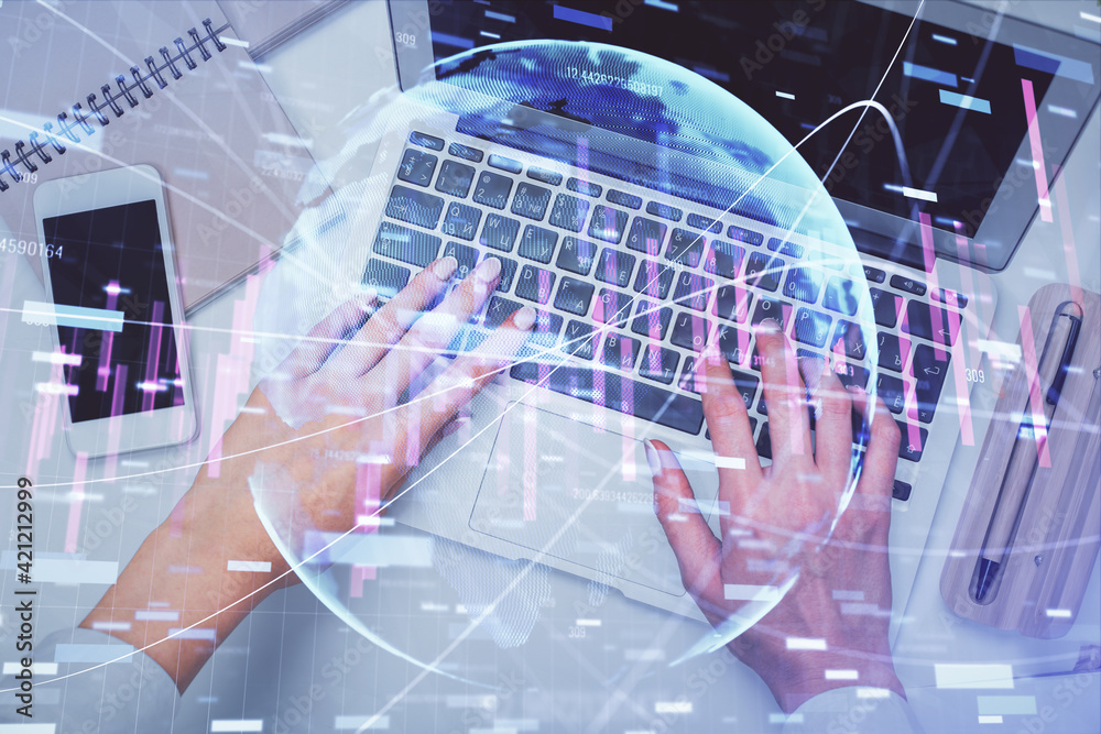 Double exposure of woman hands working on computer and forex graph hologram drawing. Top View. Financial analysis concept. Double exposure of woman hands working on computer and forex graph hologram drawing. Top View. Financial analysis concept.