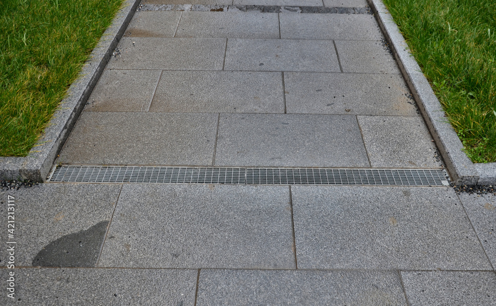 Path Gutter across the path there is a channel with a metal grid for drainage ...