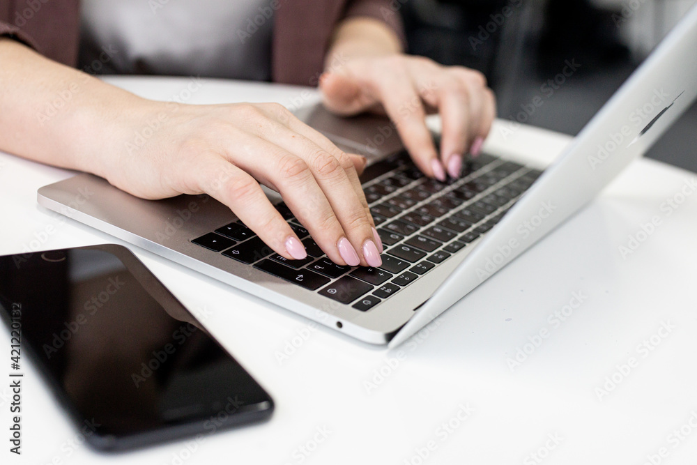 Female office worker typing on the keyboard,working at home office hand on keyboard close up. High quality photo Female office worker typing on the keyboard,working at home office hand on keyboard close up. High quality photo
